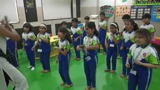Grade1 learners while doing garba dance .