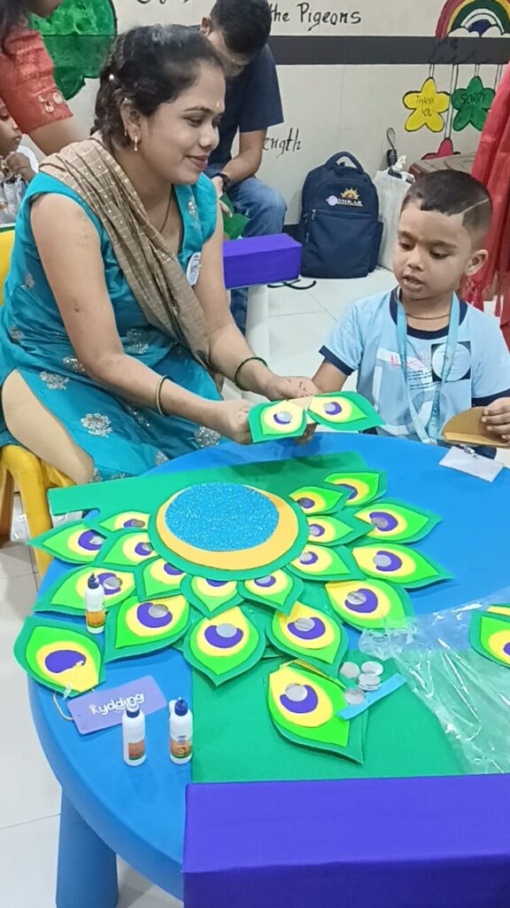 Bachpan: Creative Celebration of Childhood is a new endeavor that the Omkar Education Trust’s preschools, Omkar Catterpillar Kidz inaugurated.The Bachpan event’s goal is to strengthen the bonds between kids and parents as well as the community by offering a variety of creative activities. More than seventy toddlers and their parents participated in the creation of a Ganesha idol, Makhar, and the recitation of the Ganpati shloka and aarti on Saturday, 31st August 24, Parents and children felt a sense of pride, happiness, and camaraderie as a result of this event. It also facilitated parent-child interaction, getting together, and community building for parents of children between the ages of two and six. It was amazing to watch the young kids make a Ganesh idol and the makhar and recite shlokas. They carried their Ganpati idol, makhar and a complimentary Aarti book provided by Omkar Cat…